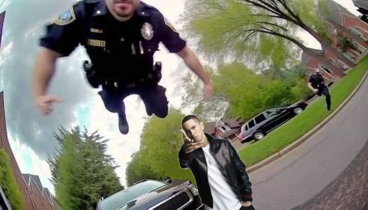 a picture of a cop jumping at the camera. eminem has been edited in to make it look like he threw the cop
